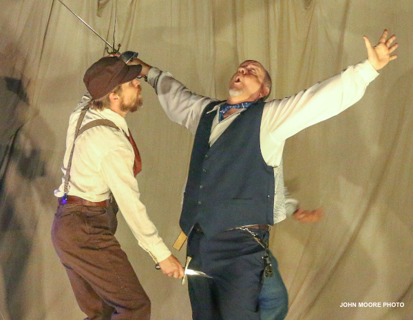 Bruce Laks, as Sir Toby Belch in Shakespeare in the Wild's 2024 production of 'Twelfth Night,' has a close encounter with Leigh Miller. (Photo by John Moore)